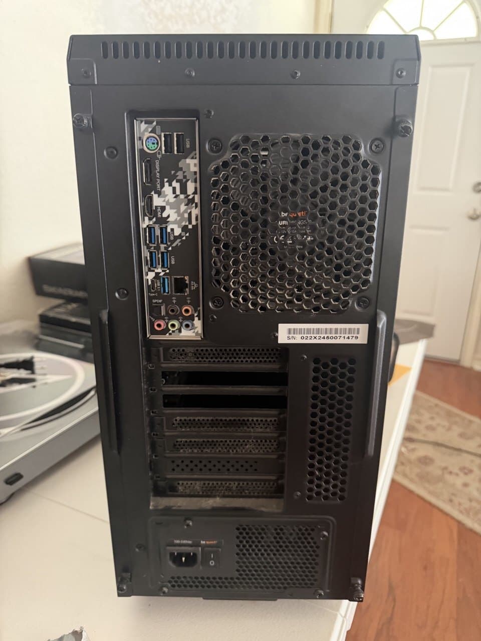 The finished build from the back — rear I/O ports and power supply, cleanly wired