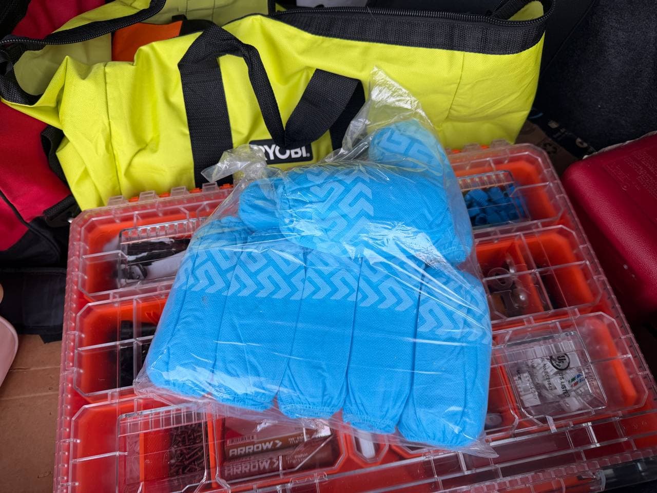 Blue disposable shoe covers packed in Nick's on-site field kit